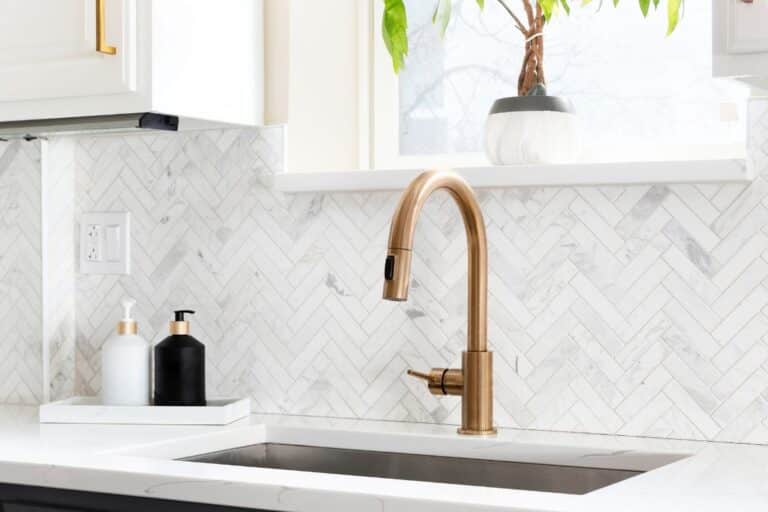 A countertop and sink with a backsplash