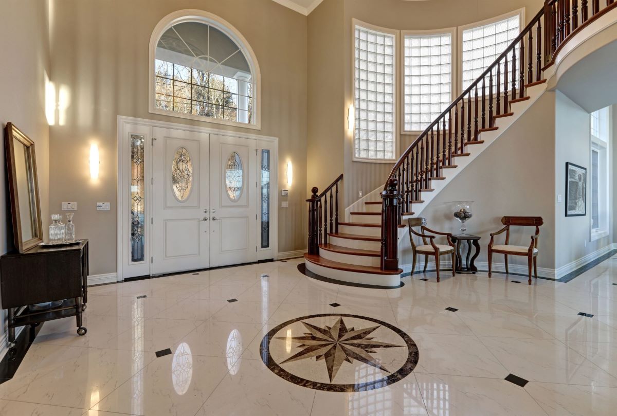 A home foyer with decorative floor tiling